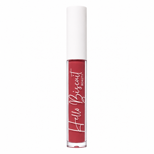 A standing clear tube of Hello Biscuit Beauty Watermelon Crawl Dark Pink Lip Gloss showcasing the vibrant dark pink formula and white script logo on a white background
