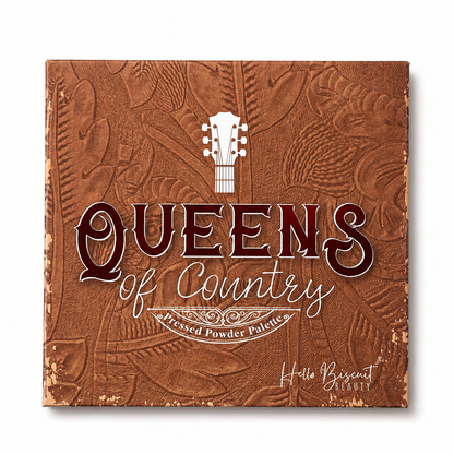 he closed cover of Hello Biscuit Beauty Queens of Country Eye Shadow Palette featuring a brown tooled leather texture with a white guitar illustration and script logo on a white background