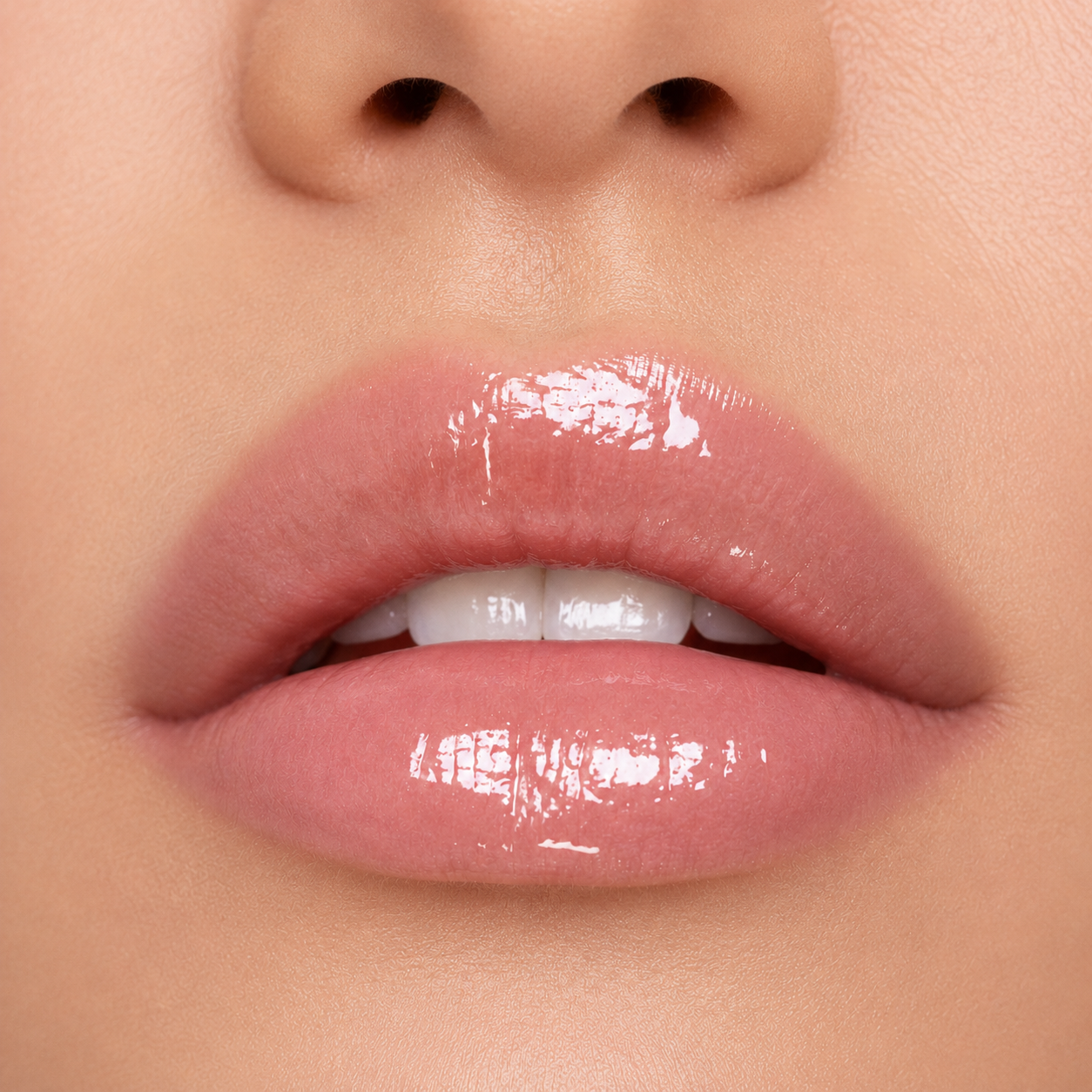 A detailed close up macro view of a model wearing the high gloss and crystal clear Hello Biscuit Beauty Cowboy Casanova Clear Lip Gloss showing a shiny mirror finish