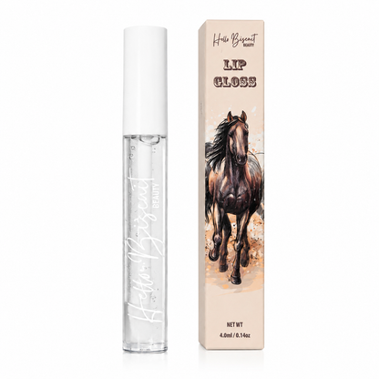 A clear tube of Hello Biscuit Beauty Cowboy Casanova Clear Lip Gloss next to its custom packaging box featuring a realistic brown horse illustration on a white background