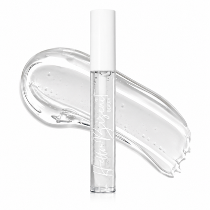 A clear tube of Hello Biscuit Beauty Cowboy Casanova Clear Lip Gloss placed over a large thick and smooth clear liquid makeup swatch on a white background