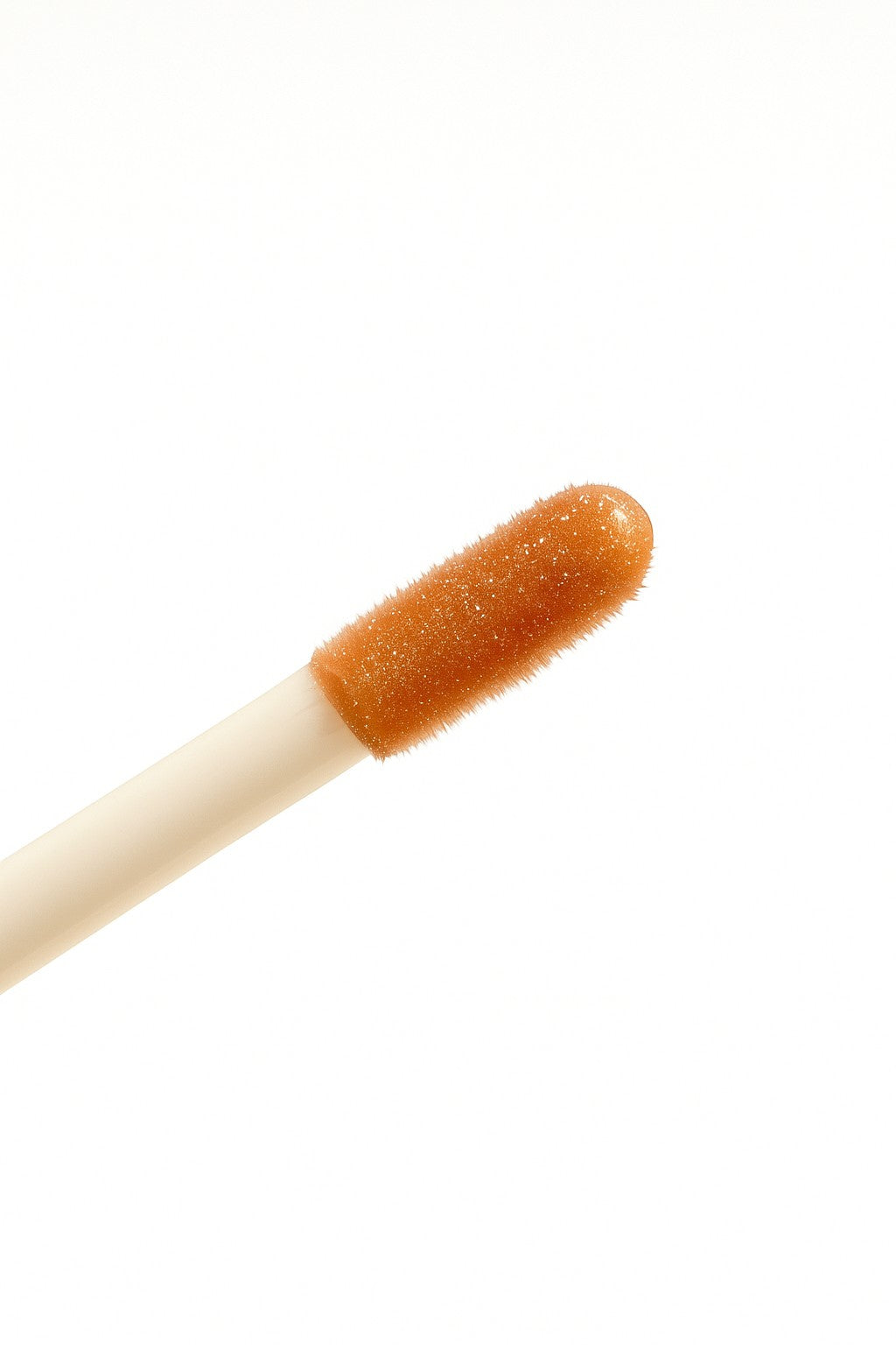 Hello Biscuit Beauty Palomino Lip Gloss applicator with clear, sparkly pink gloss. Non-sticky formula for glossy lips.