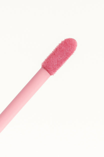 Hello Biscuit Beauty Strawberry Wine lip gloss applicator with soft pink fuzzy tip and pink handle.