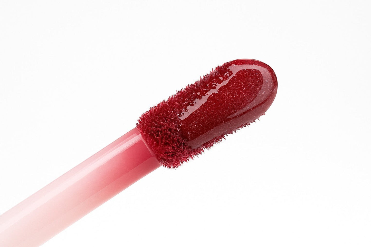 Hello Biscuit Beauty Watermelon Crawl dark pink lip gloss with a shiny, smooth finish and Vitamin E.