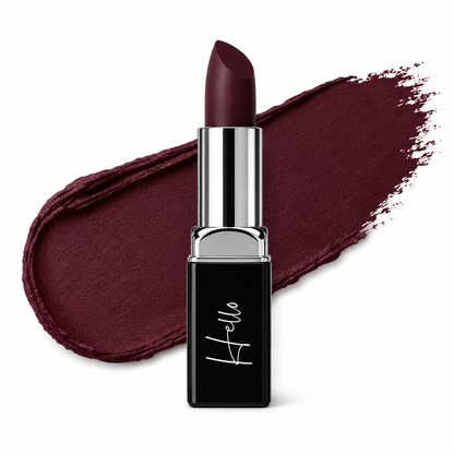 An open tube of Hello Biscuit Beauty Jolene matte lipstick rolled up to reveal a deep sparkling burgundy red shade against a matching textured wine colored lipstick swipe