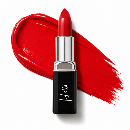 An open tube of Hello Biscuit Beauty Kiss This creme lipstick rolled up to showcase the bright red shade against a thick matching creamy lipstick swipe on a clean white background