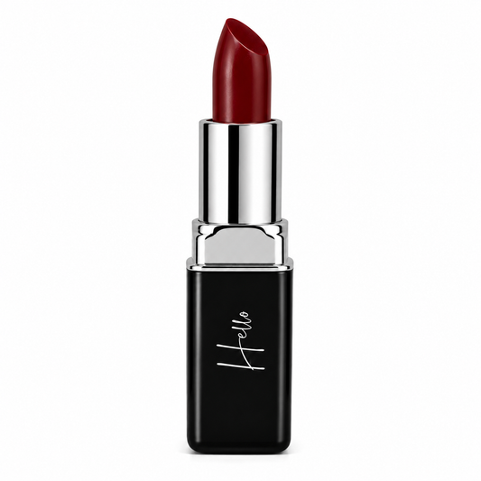 An open tube of Hello Biscuit Beauty Mamma Tried creme lipstick rolled up to showcase the bold outlaw red shade in its black casing with a white script logo on a clean white background